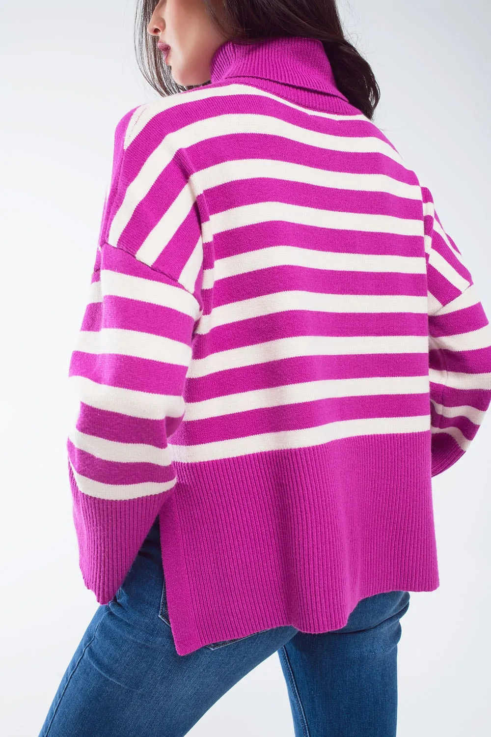 Fuchsia oversized trutleneck sweater with white stripes and splits on the side