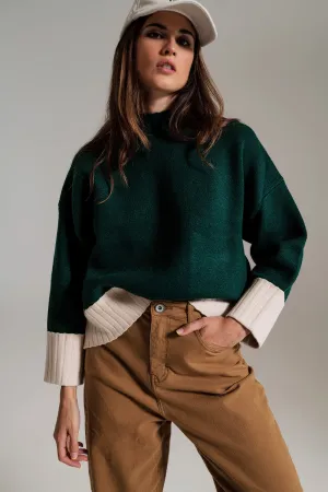 green jumper with white ribbed cuffs and hem